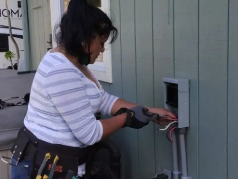 Licensed electrician wiring an exterior subpanel in South Patrick Shores